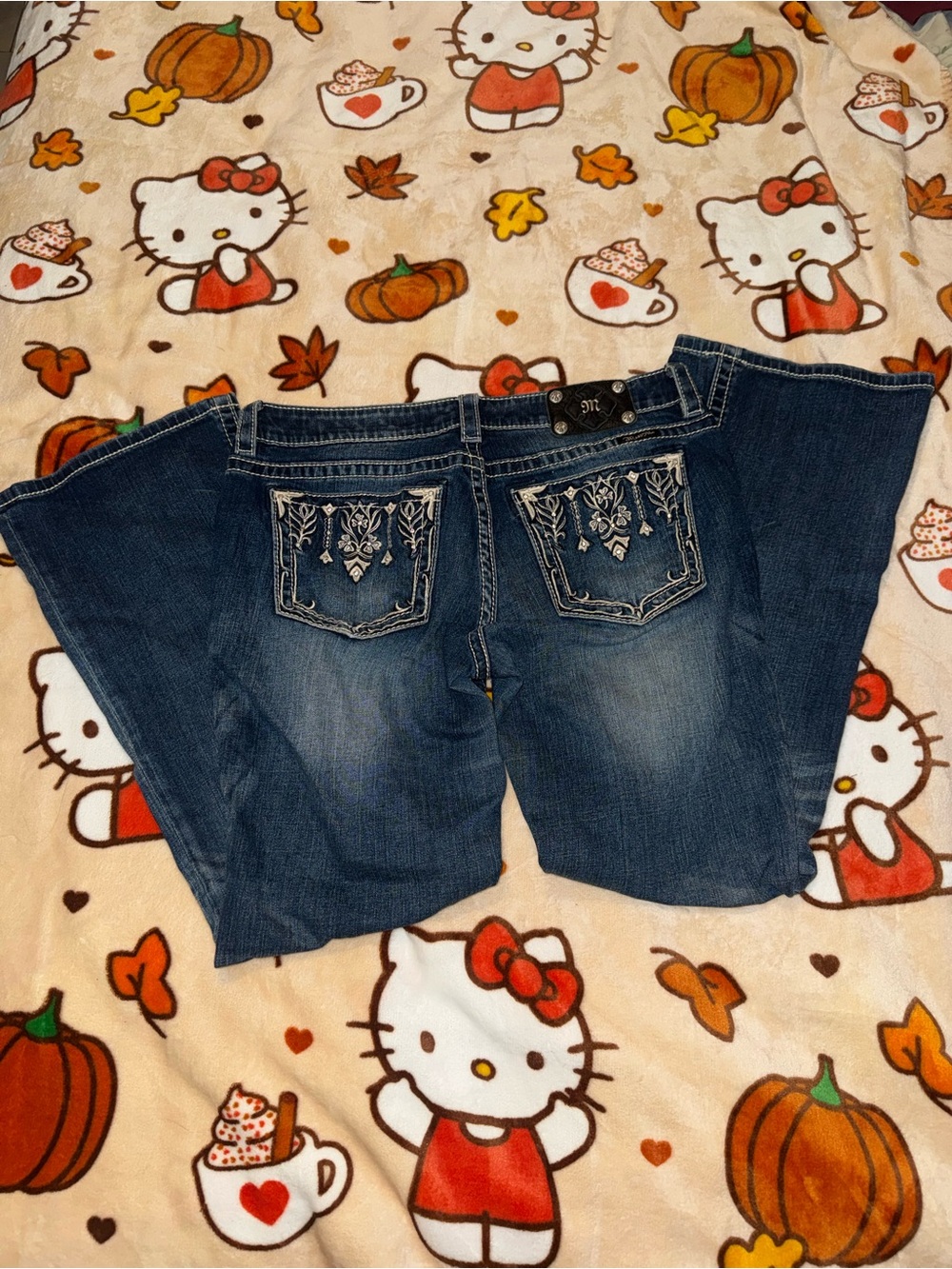 y2k miss me low rise boot cut jeans with embroidered floral designs size 33